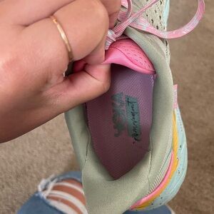 Hoka Green and Pink Athletic Shoes with Pastel Accents